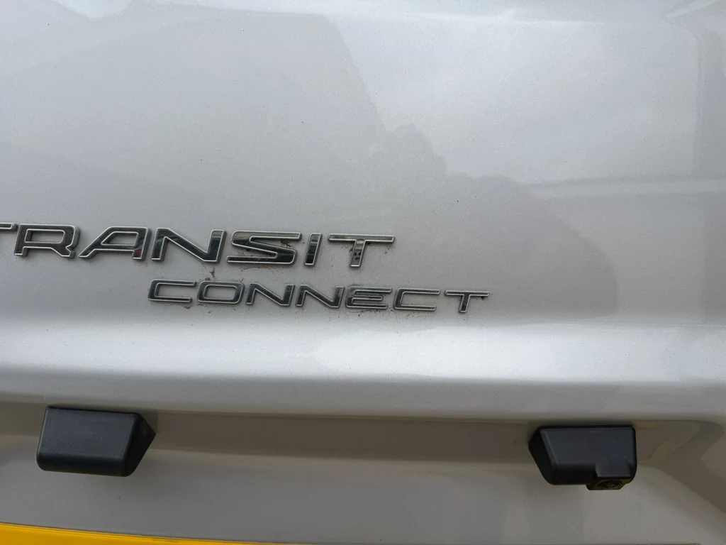 Rear doors of a Ford Transit Connect with a reversing camera fitted above the number plate
